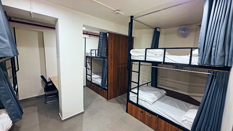 Dorm room with study desk at Shikha Hostel Jaipur